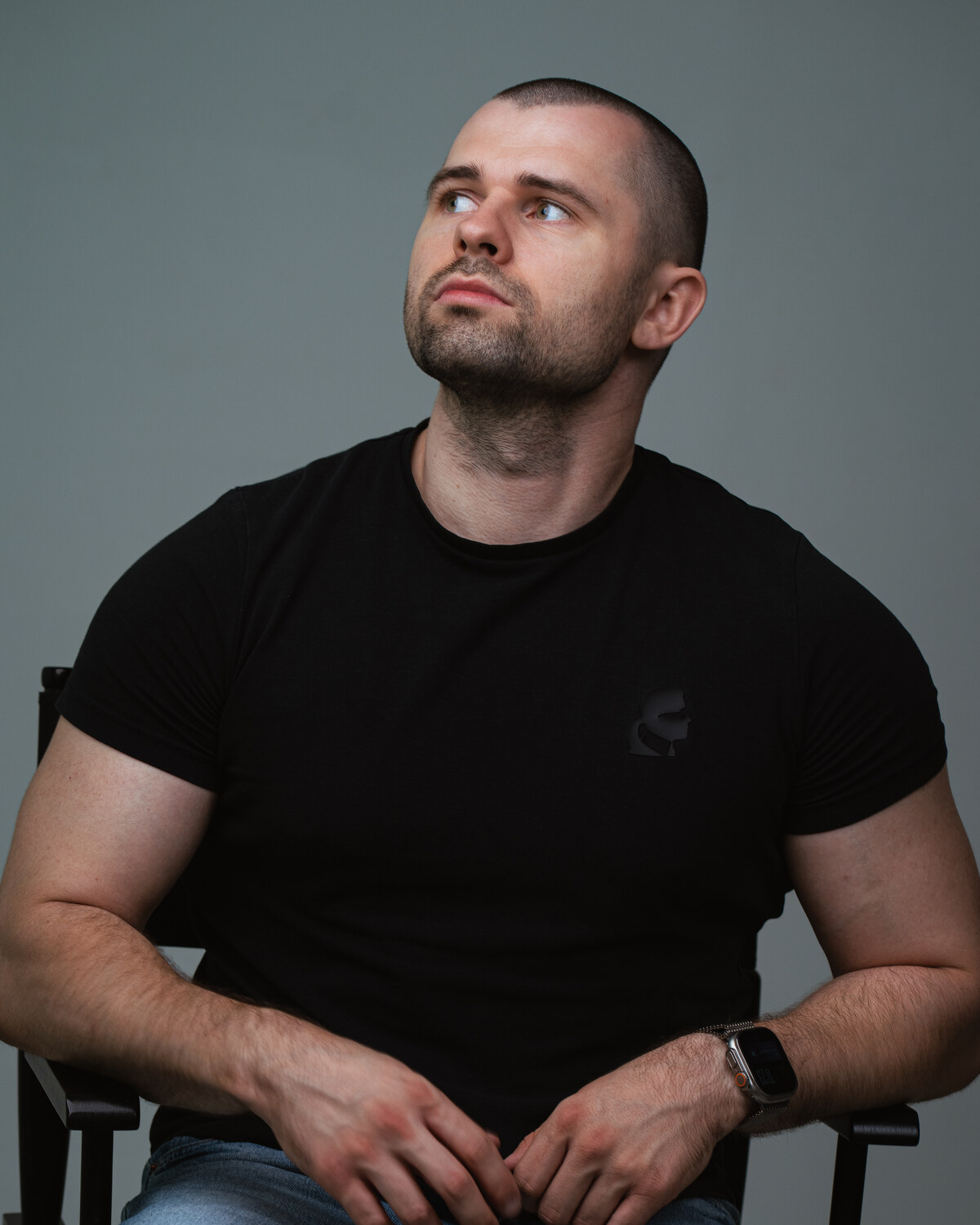 Lukas Granatier in a black and white workspace portrait
