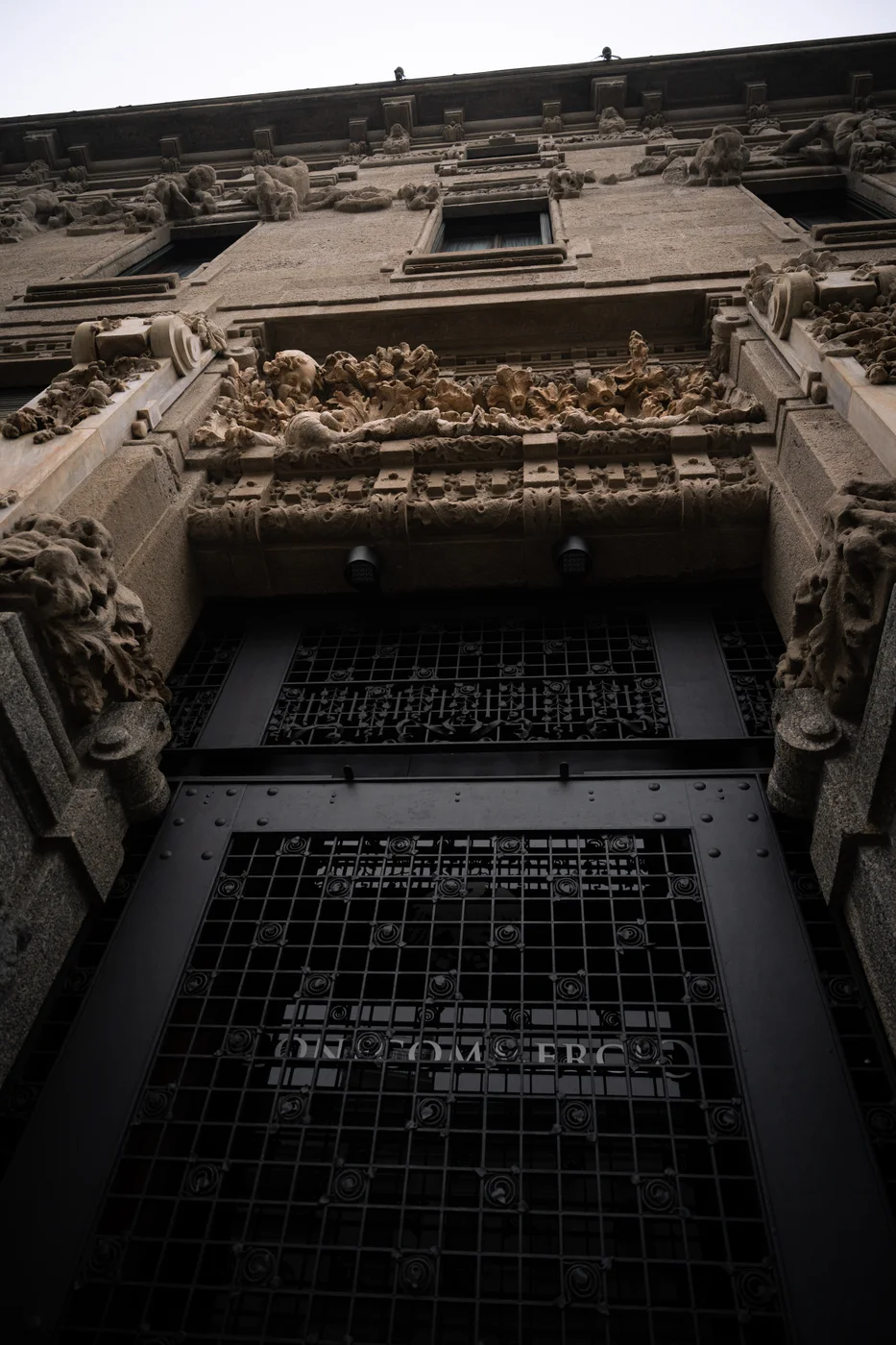 An ornate stone facade photographed from below